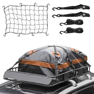 Car roof cargo carrier with net and straps for secure travel.