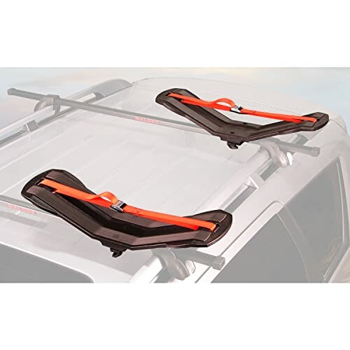Car roof with kayak carriers and straps