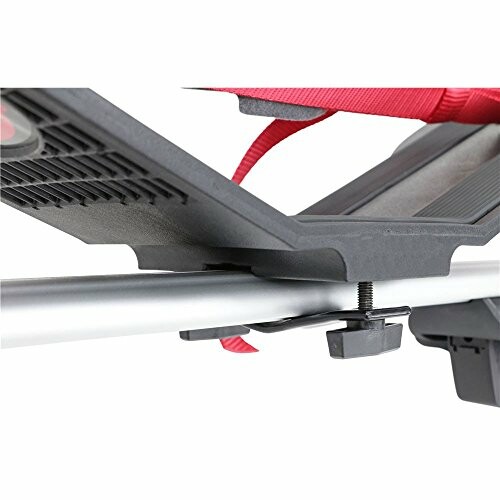 Close-up of a car roof rack mount with a tightening knob.