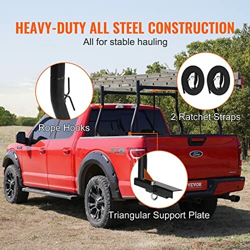 Red truck with steel construction rack for hauling, featuring rope hooks and ratchet straps.