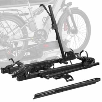 Hitch-mounted bike rack with a bicycle in the background.