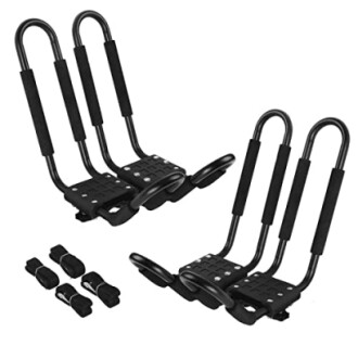 Set of black kayak roof rack carriers with straps.