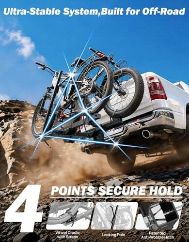 Truck with bike rack on rocky off-road terrain.