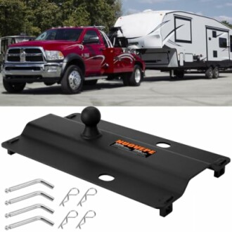 Truck towing a camper trailer with a hitch and pins displayed below.